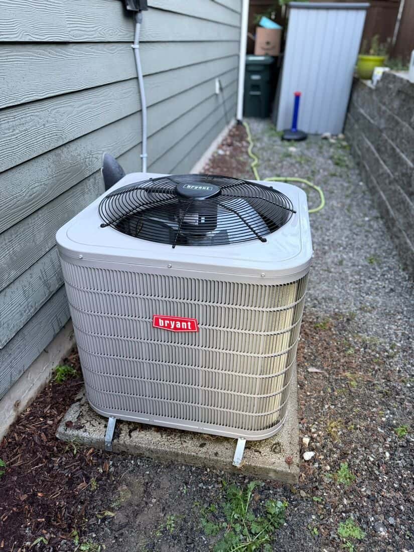 The same Bryant condenser back together on the same concrete pad with a clean coil