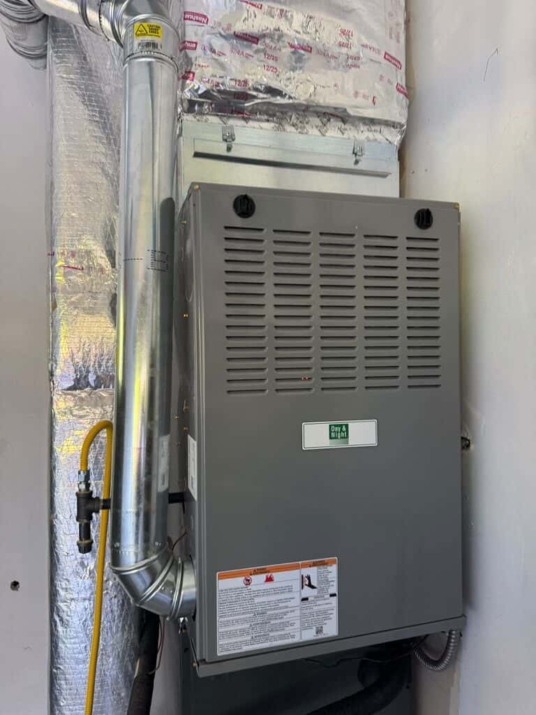 Furnace installed in a tight utility space with new flue and gas line